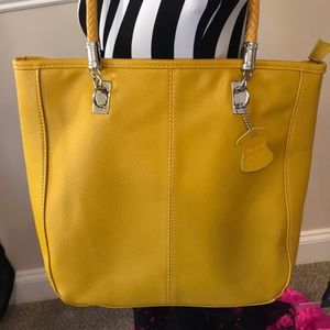 Mustard yellow color handbag with braided straps